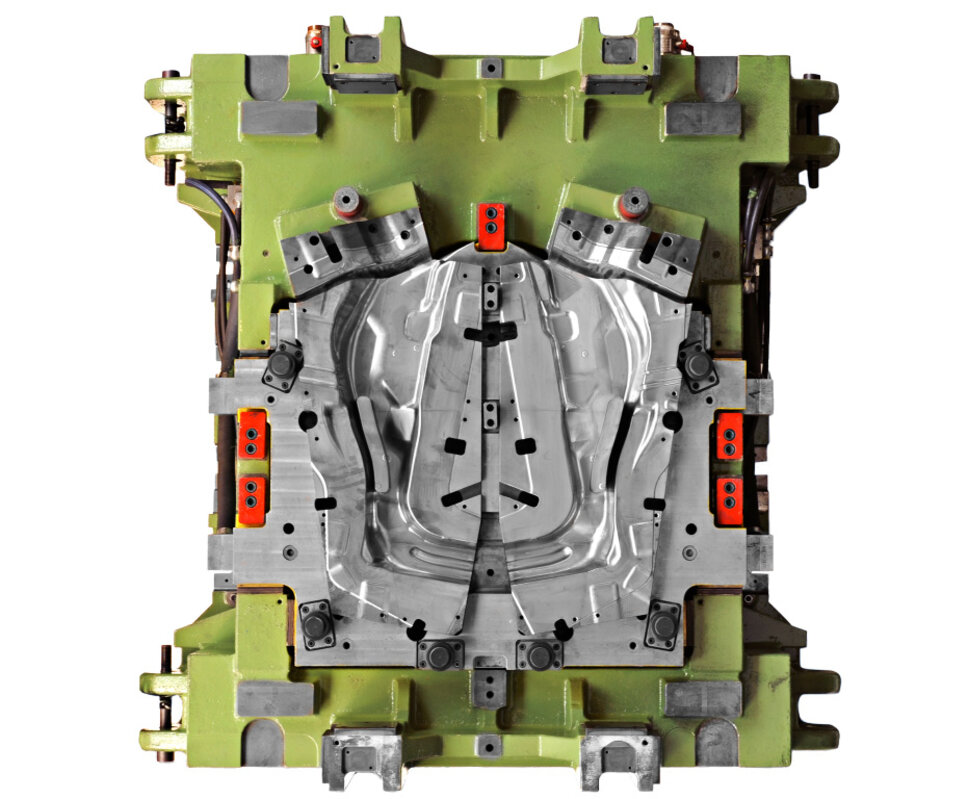 A green forming tool for the hot forming of A-pillar reinforcements in vehicles, captured from an aerial perspective.