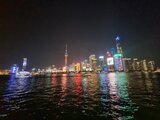 Night view of Shanghai’s illuminated skyline with colorful reflections on the water – a highlight of Jan Wengryn’s year in China.